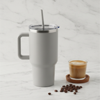 Toolbox Coffee 40 oz Light Grey Tumbler on marble countertop with latte glass